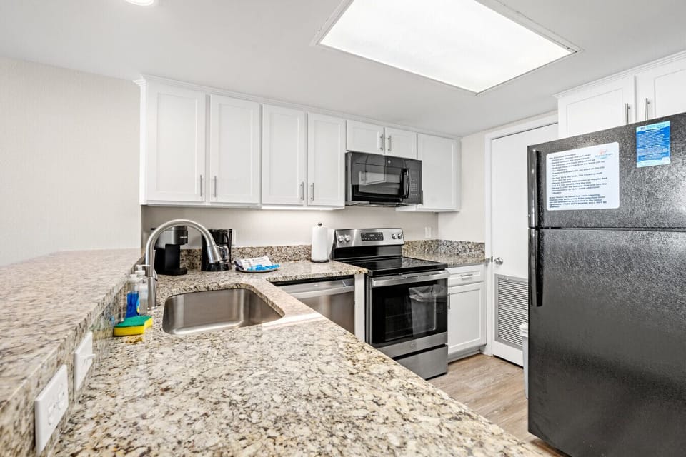 Full kitchen equipped with all the amenities, including modern appliances, ample cabinet space, and everything needed to prepare meals comfortably during your stay.