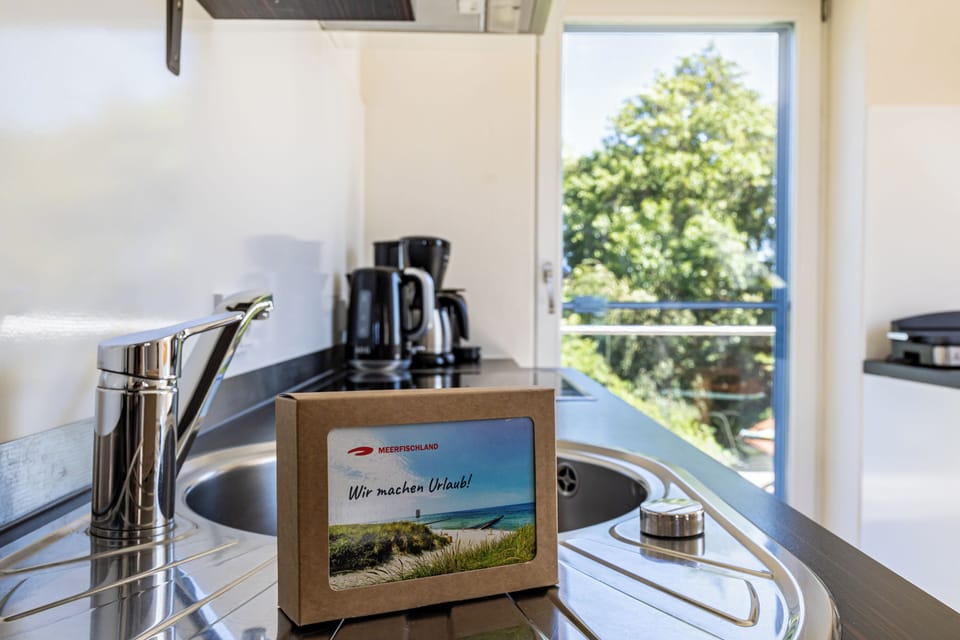Modern kitchen with sink and coffee machine