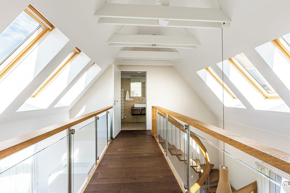 Bright hallway with access to the modern bathroom