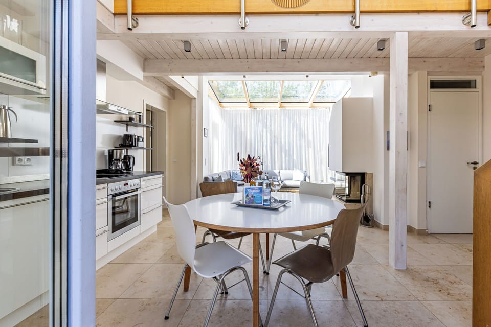 Modern kitchen with dining table and seating