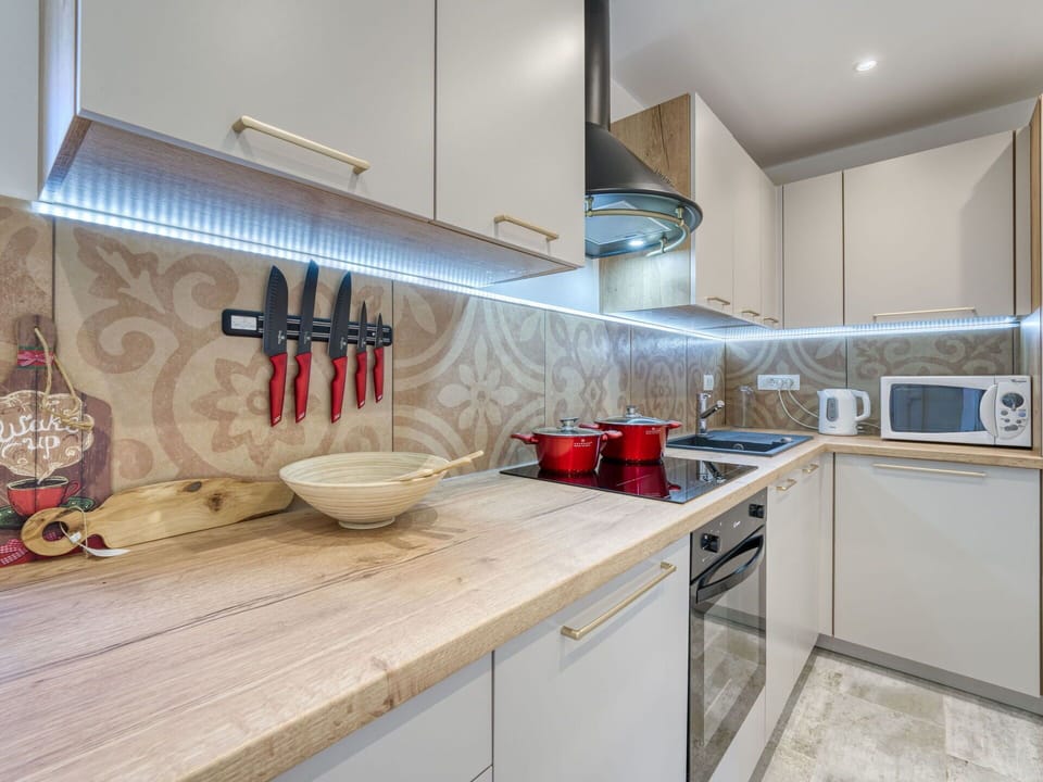 Countertop, Kitchen, Wood, Flooring, Interior Design, Kitchen Appliance, Major Appliance, Cabinetry, Floor, Home