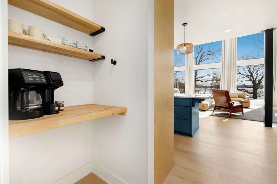 This entire space is flooded with natural light and boasts gorgeous views of Beaver Lake from every angle. 