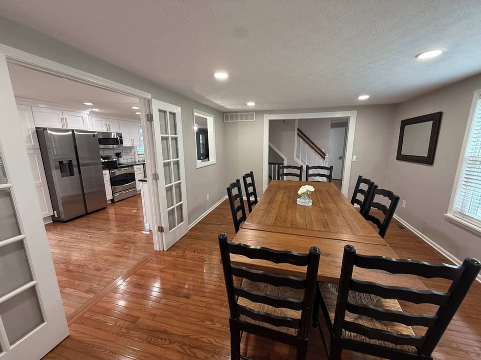 Very large dining room seating for eight. High chair in front closet.