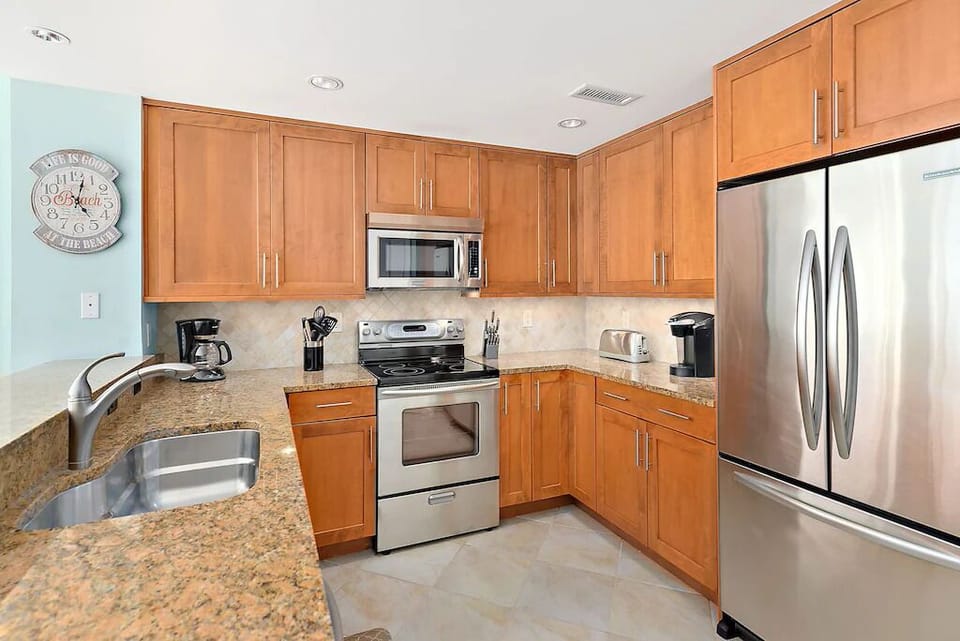 The Kitchen's gleaming Granite Countertops, high-end Stainless Steel Appliances, and all the conveniences of home, will delight the Chef in your family