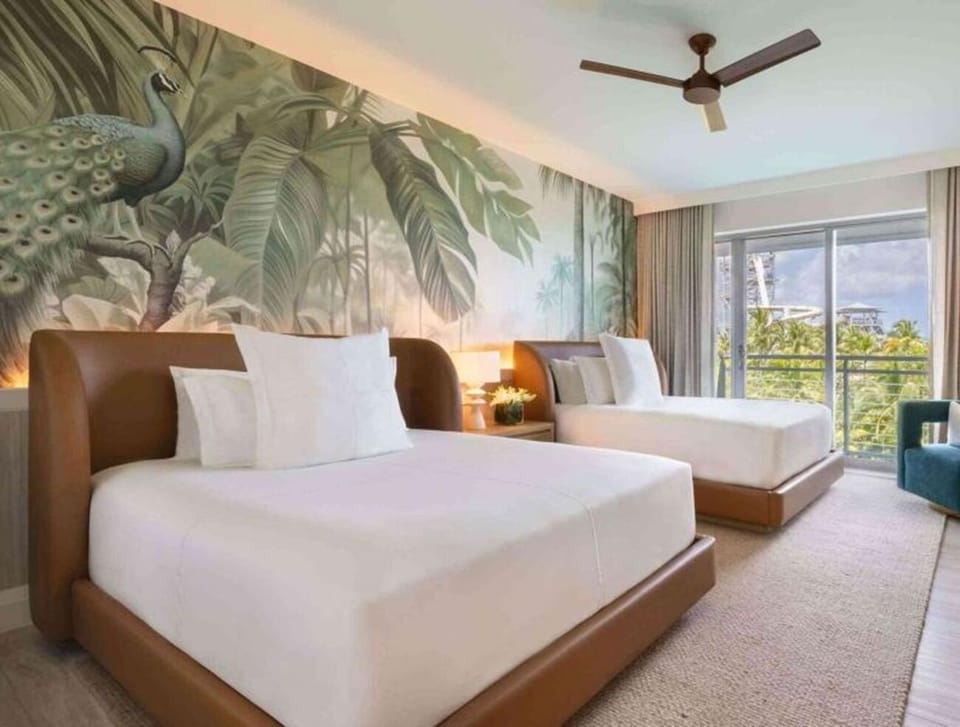 Unwind in a bright twin room with breezy balcony views.