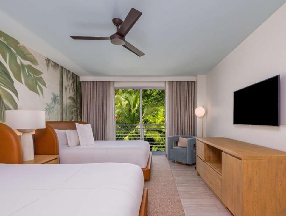 Start mornings with balcony breezes and palm-framed serenity.