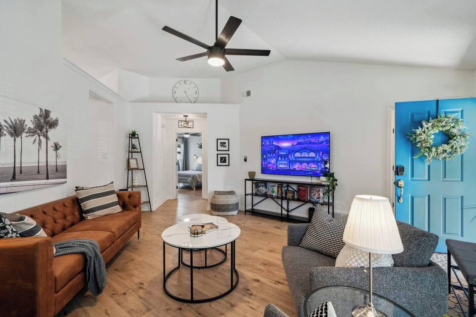 Large bright open living with comfortable seating, 65 Roku TV, Multiple Board Games (Chess/Checkers, Sorry, Jenga), Essential Oil Diffuser, Yoga Mat with Blocs.