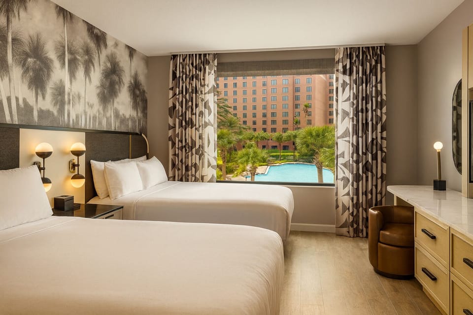 Unwind in crisp beds with a serene pool view.