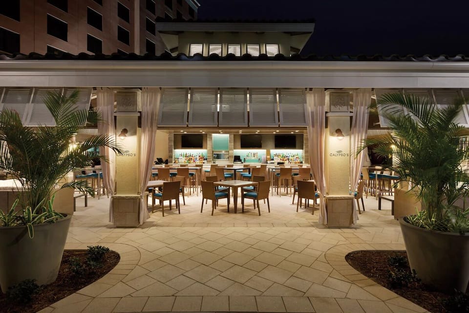 Enjoy warm evenings outside with a softly lit courtyard vibe.