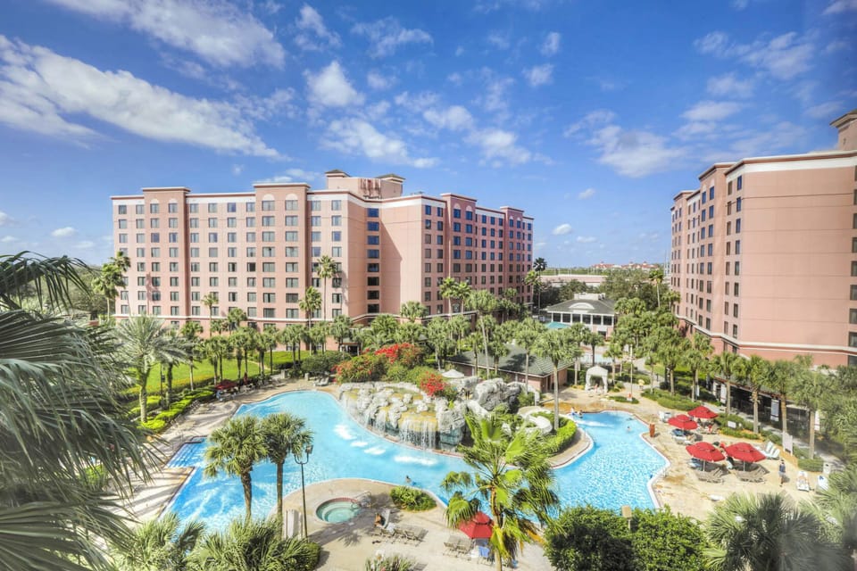 Picture your day around expansive pools, palms, and plush loungers.