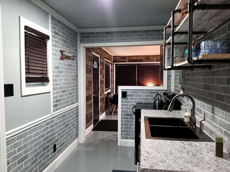 galley kitchen with bar looking into family rm, total dining seating for 6