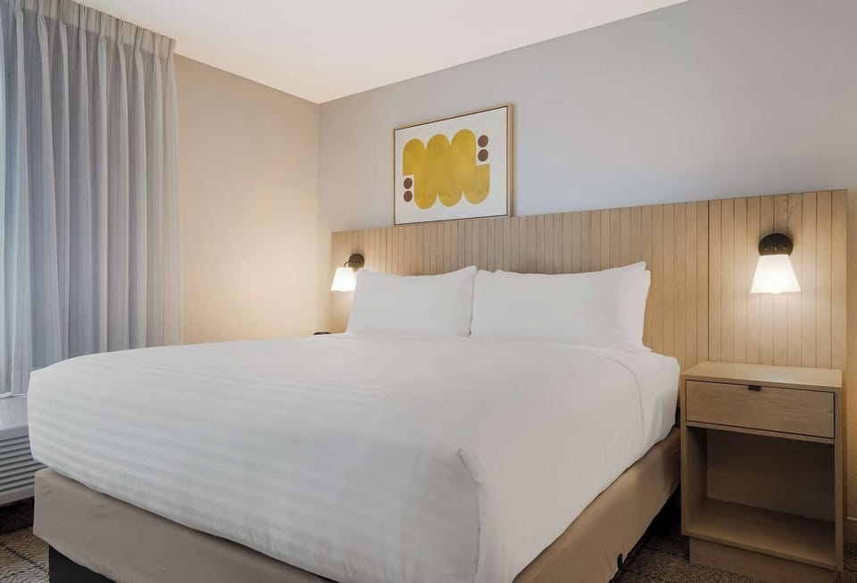 Drift off comfortably with bedside lighting and serene tones.