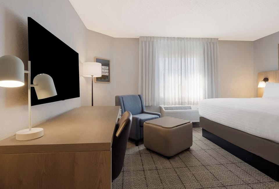 Wake to gentle daylight and a beautifully made, cozy bed.