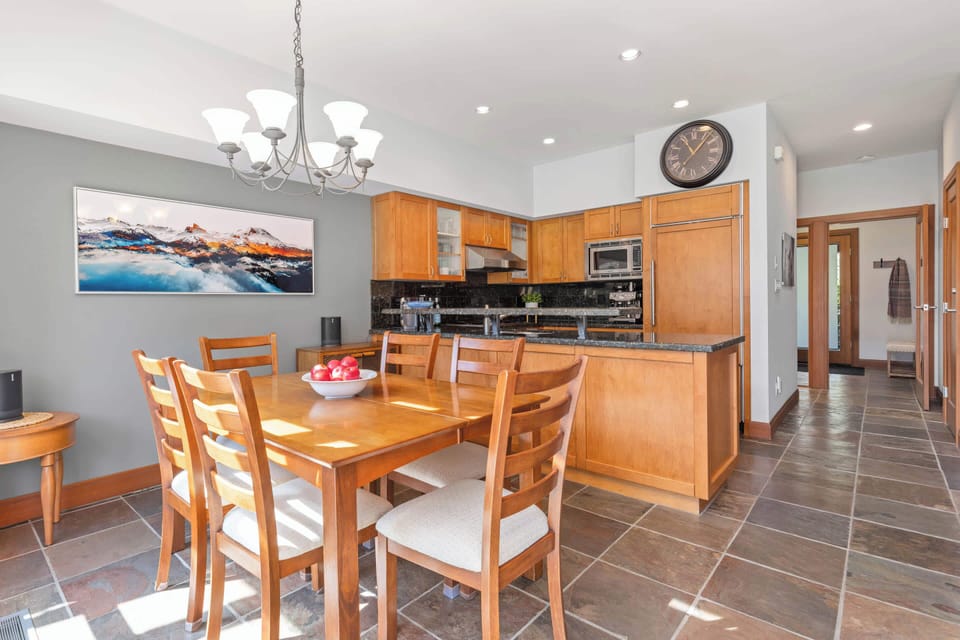 - Spacious dining area beside a fully equipped kitchen  
- Stainless appliances and breakfast-ready island  
- Gather for homecooked meals and warm conversations  
