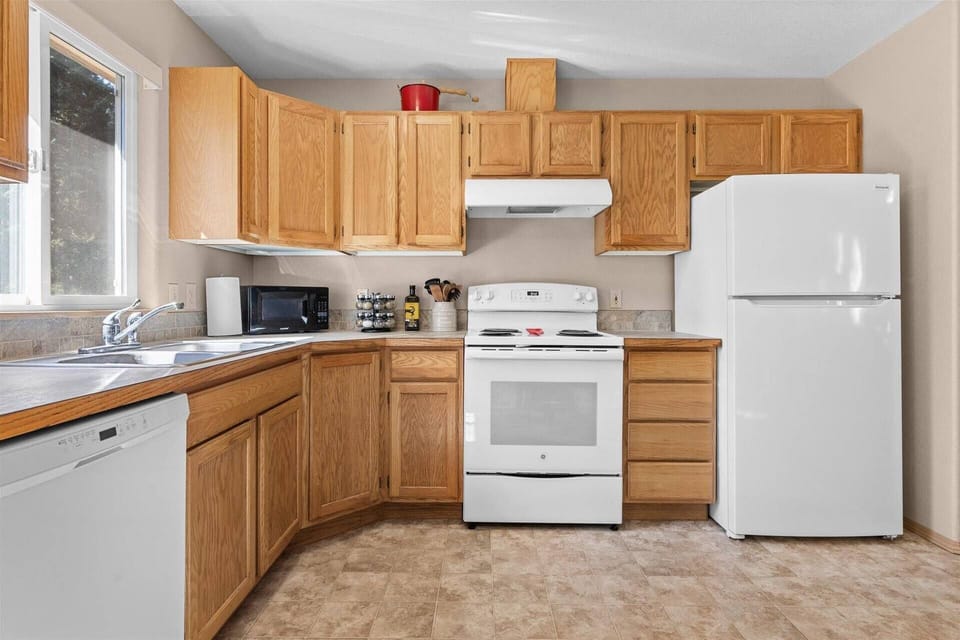 Kitchen with oven/stove, dishwasher, microwave, fridge, and coffee maker!