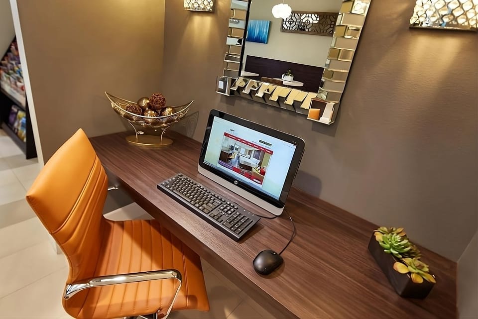 Catch up on emails comfortably at the convenient business station.