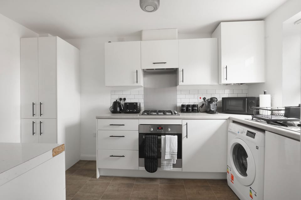 Cook, brew, and bake with ease—this modern kitchen comes with all the comforts of home