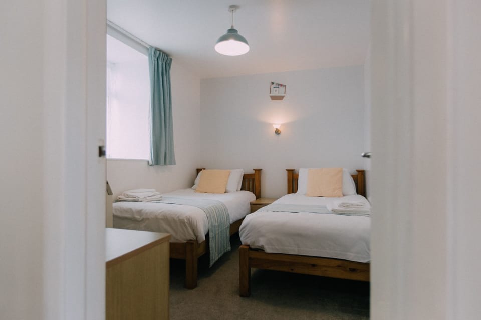 The Carthouse twin bedroom at Trevalgan Farm Holidays