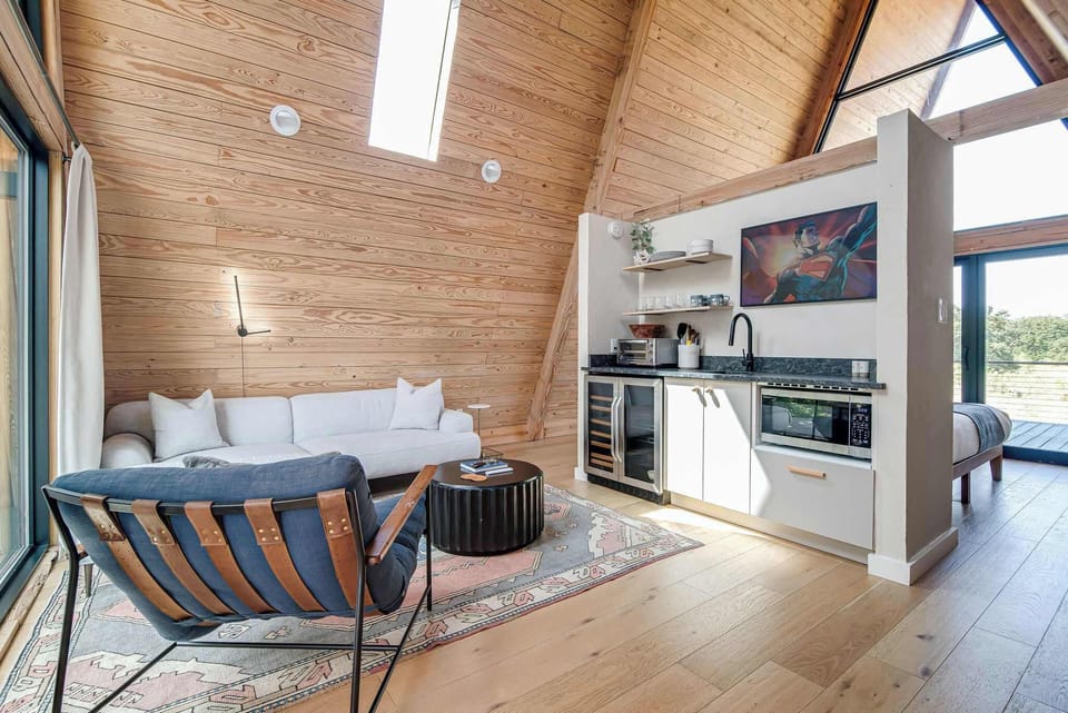 Ceiling to floor windows provide beautiful natural light in the treehouse