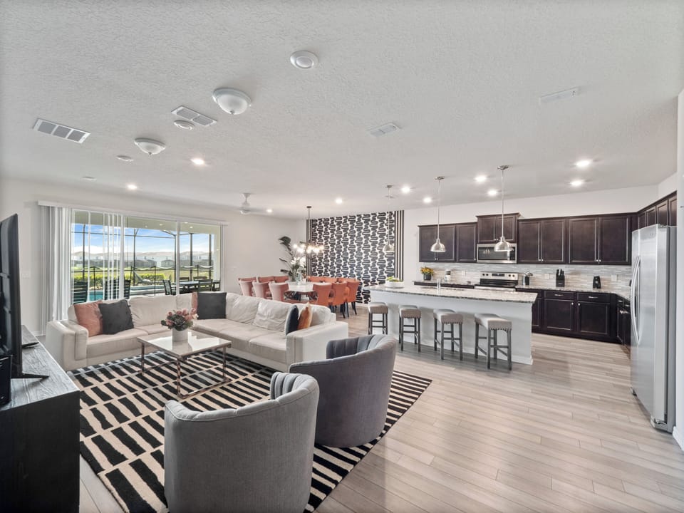 Modern Downstairs Living Area with Full Size Kitchen, Stunning Dining Table and Comfy Lounge Area