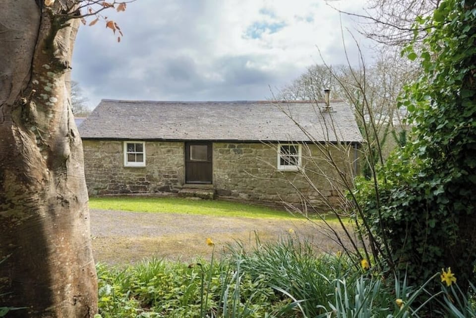 The back of The Barn - the land rises behind, this door accesses the top floor