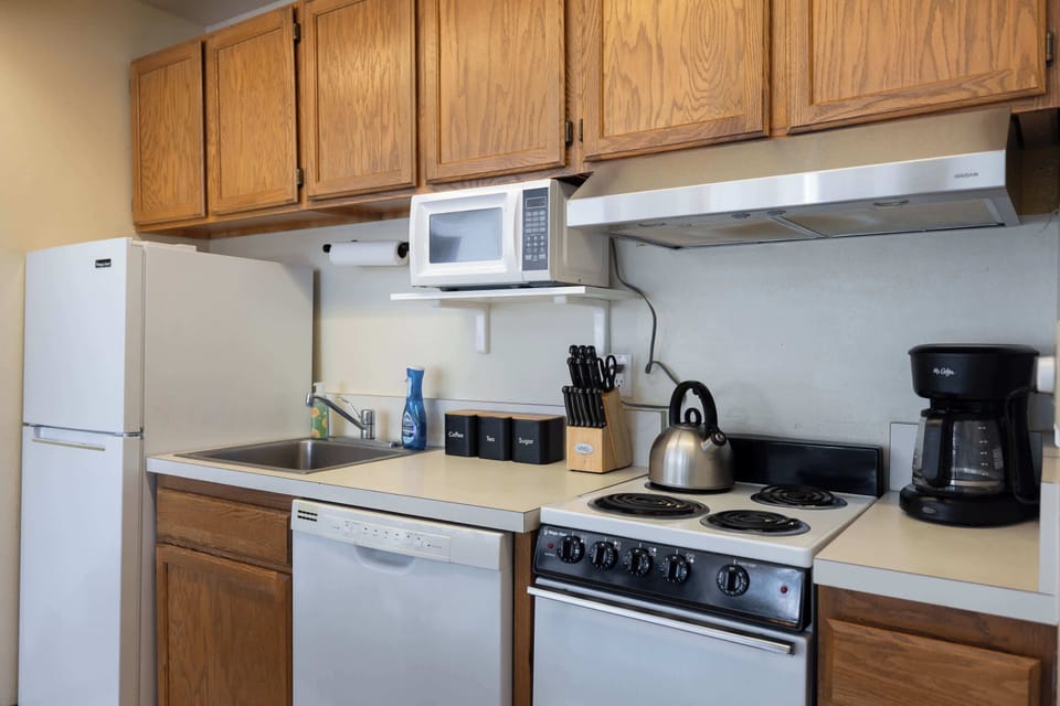 The open kitchen offers ample storage & every home comfort