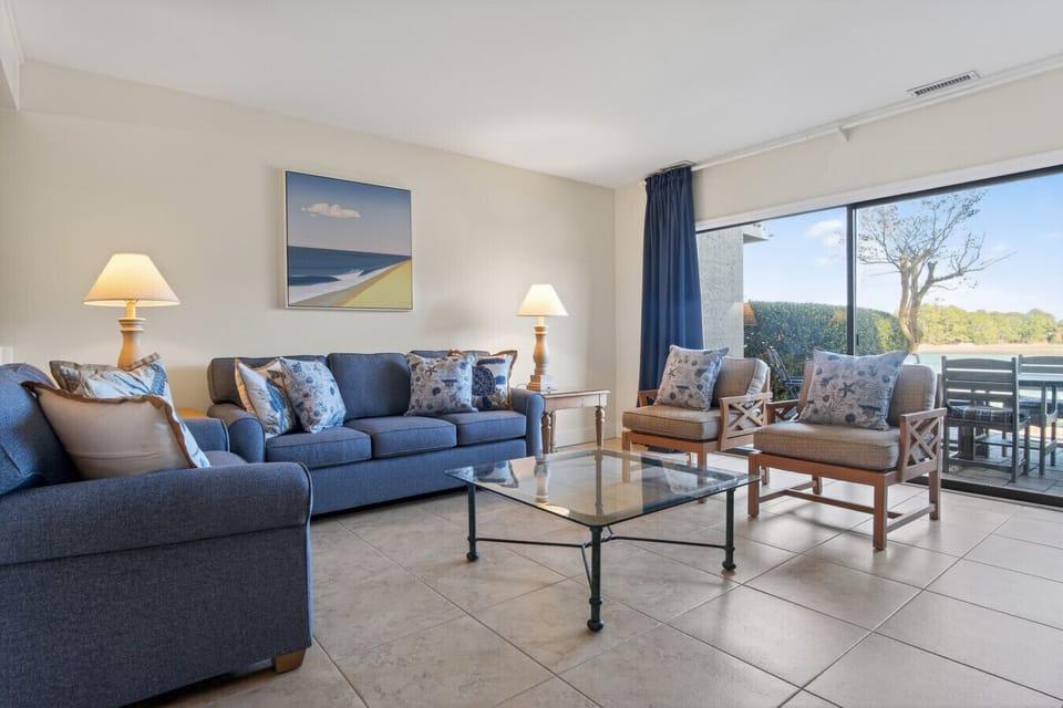 Brand Sleeper Sofa, and love seat - 2026 opens to spacious back patio overlooking the water.