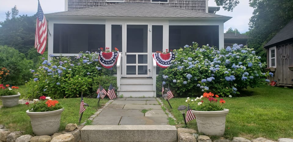 Classic Farmhouse!  House looks small.  But it's 3000 sq. feet.  Flowers galore!
