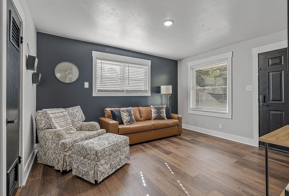 Living Room with Couch and swivel chair with ottoman, Roku TV, Games