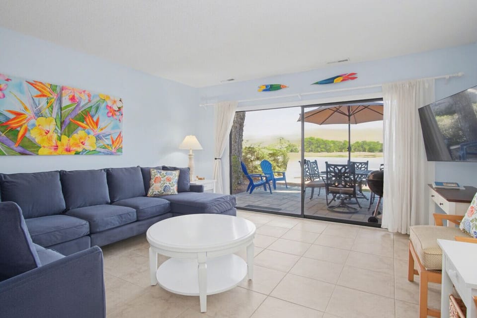 Living room featuring a flat screen TV and sliding door access to patio
