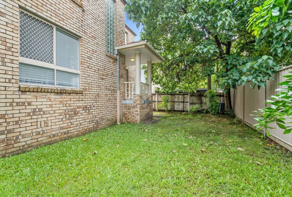 Escape into the lush backyard—a quiet spot to sip coffee, stretch out in the sun, or let little ones play while you unwind.