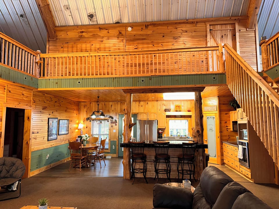 View into the kitchen, center loft walkway, & dinning from the living room.