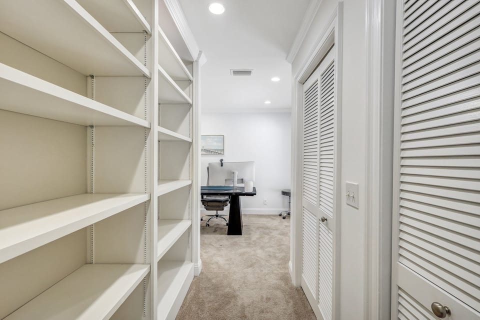 Primary bedroom entrance to the office with extra closet storage