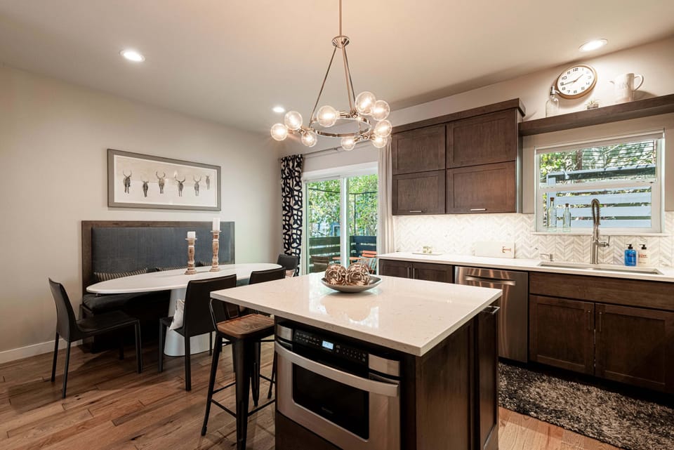 Fully Equipped Modern Kitchen with Access to the back patio, grill, & hot tub