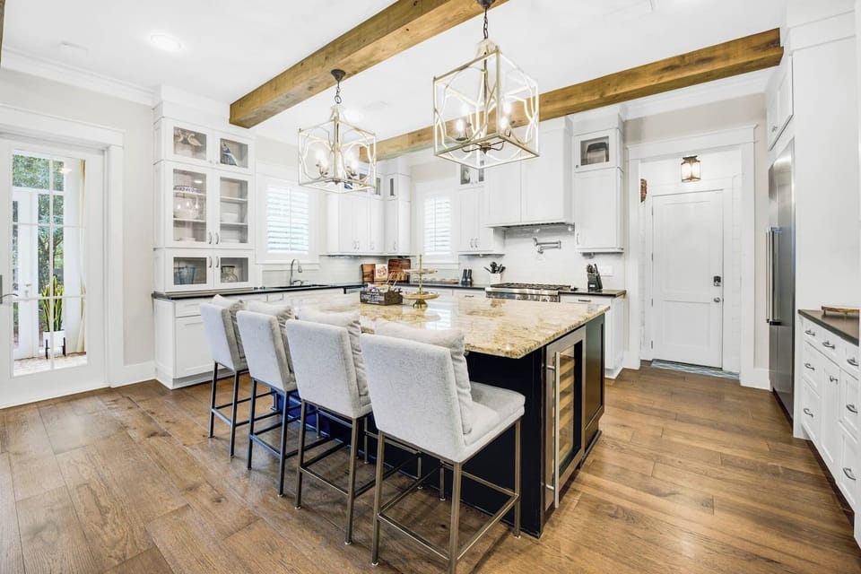 Very large island and comfortable kitchen bar stools. 