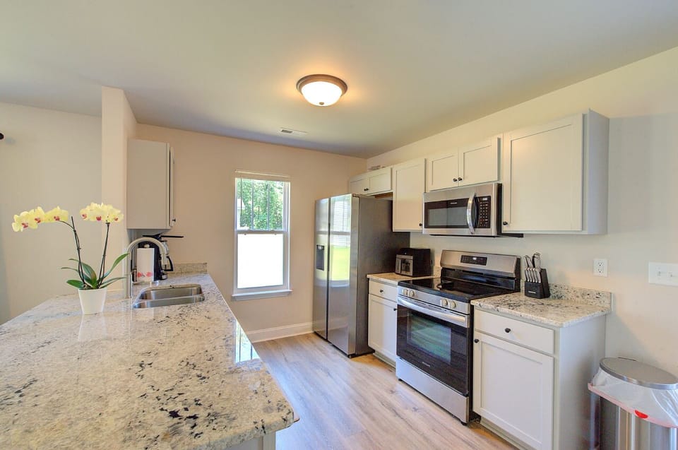 Granite kitchen countertops and stainless appliances and f