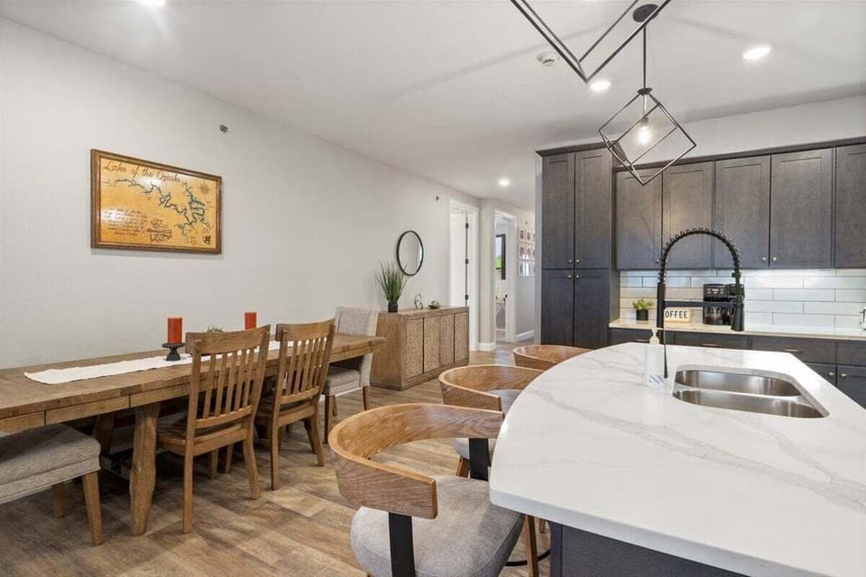 Topsider Tower's kitchen features updated counters and cabinets, and a large table for gathering together.