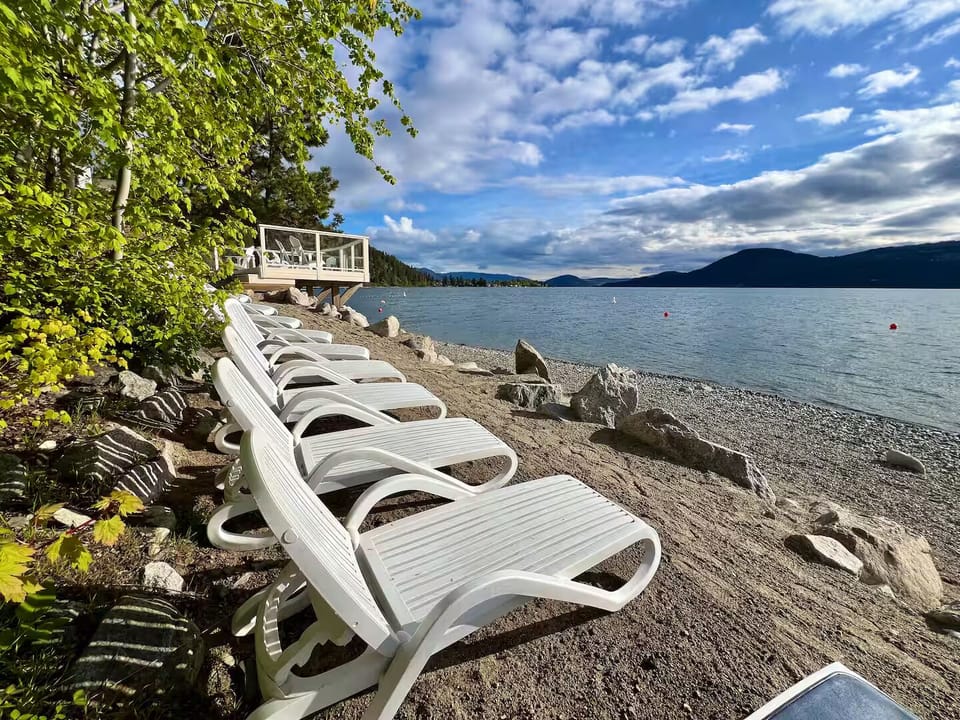 Resort beach loungers steps from the lake.