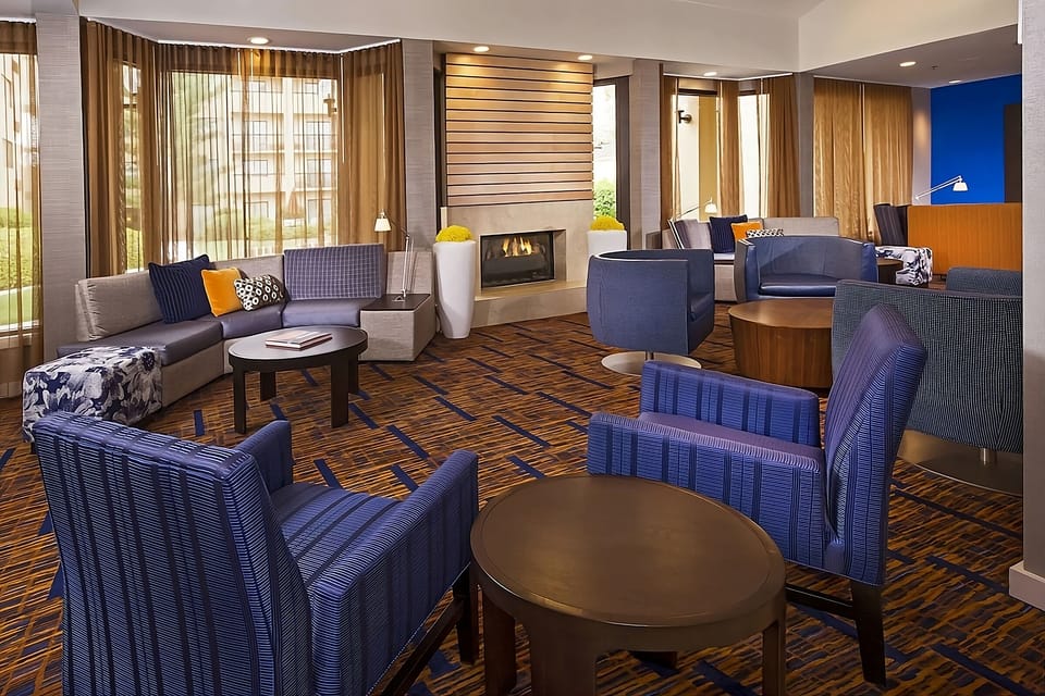 Settle in with cozy seating and a warm, glowing fireplace.
