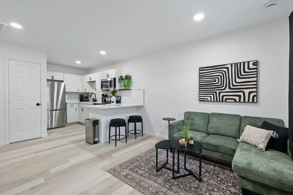 Stylish Living Area for Unit 2 with Full Kitchen Relax in the cozy living space or cook a meal in the modern, fully stocked kitchen — perfect for families, work trips, or weekend getaways.