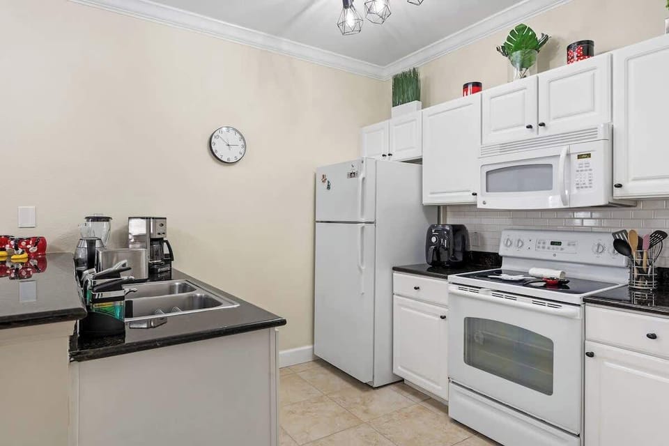 Bright fully equipped kitchen and dining areas with Disney theme details.