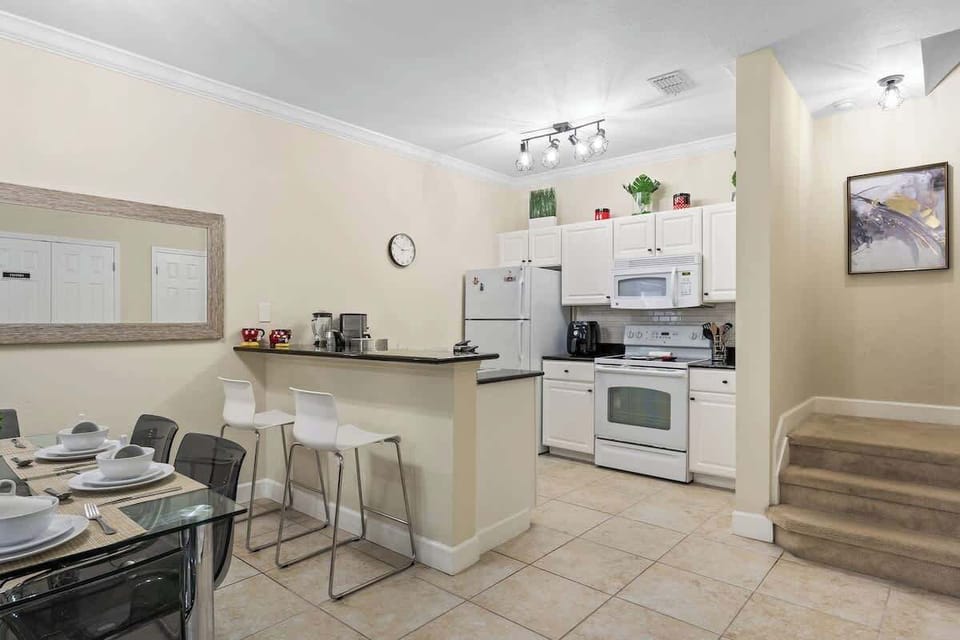 Bright fully equipped kitchen and dining areas with Disney theme details.