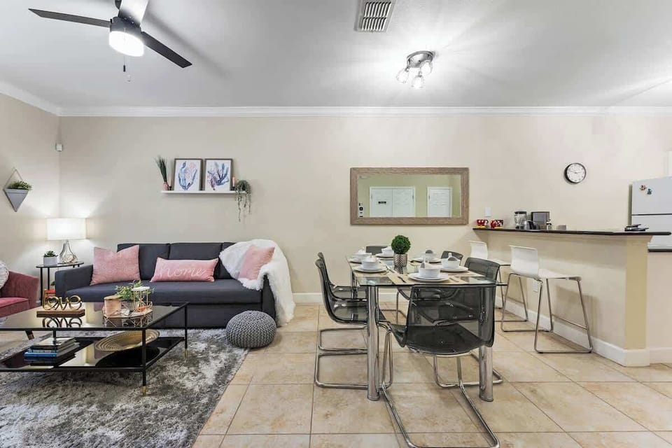 An open concept living room and dining room with charming and romantic decoration.
