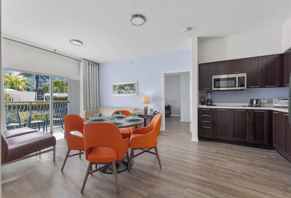 A cozy living room with an open-concept dining and kitchen, perfect for family time.