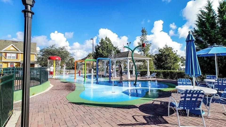 Kids' pool play area with fun splash pad features for endless enjoyment.