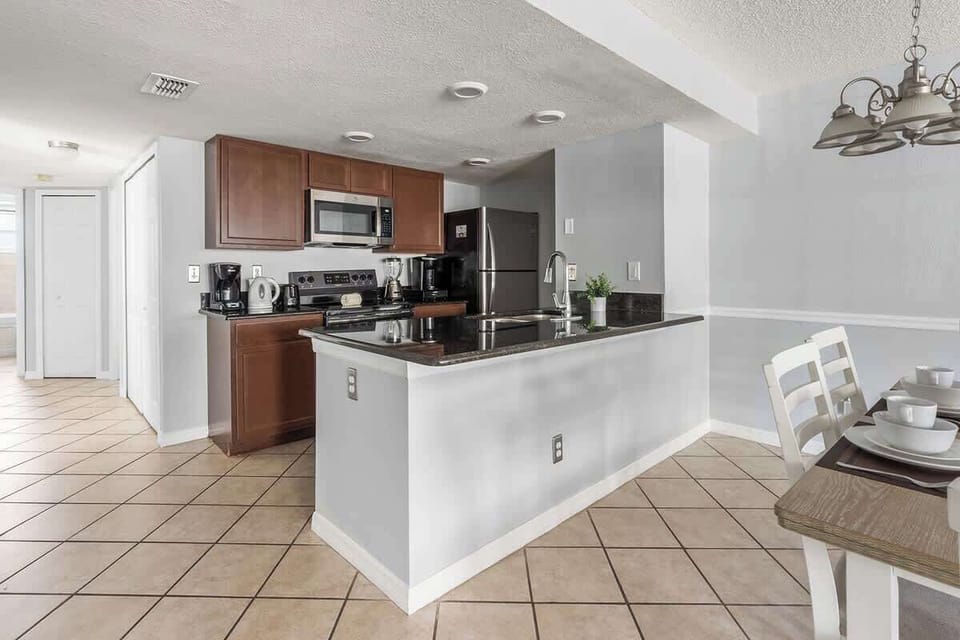 Fully equipped Kitchen with stainless steel appliances.
