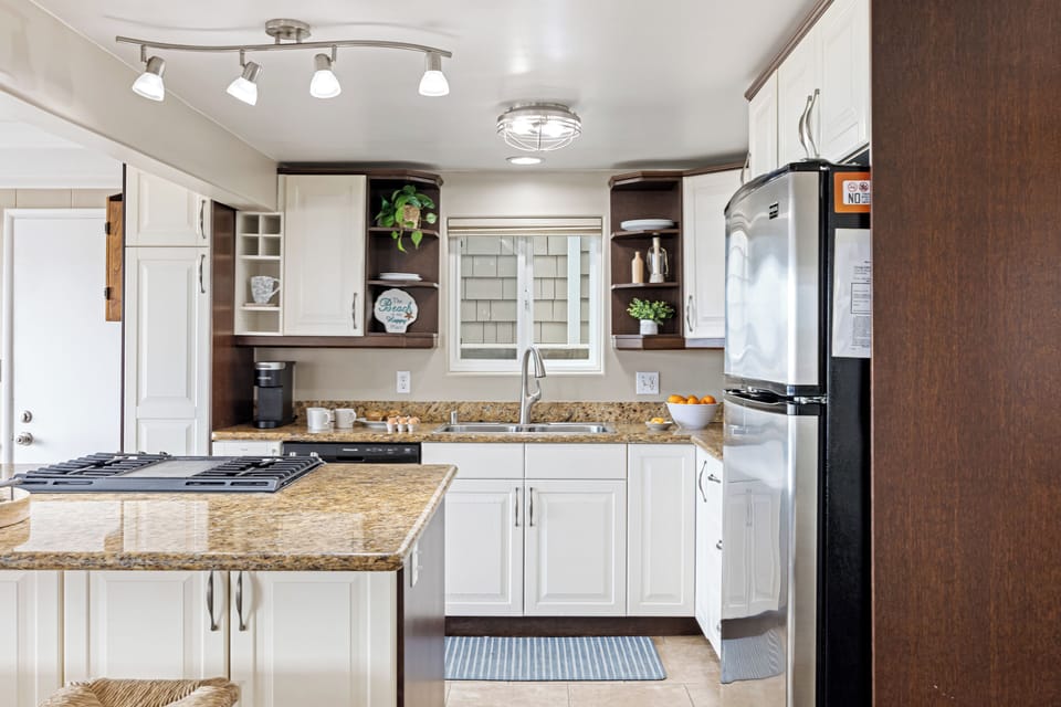 Fully equipped kitchen with modern appliances.