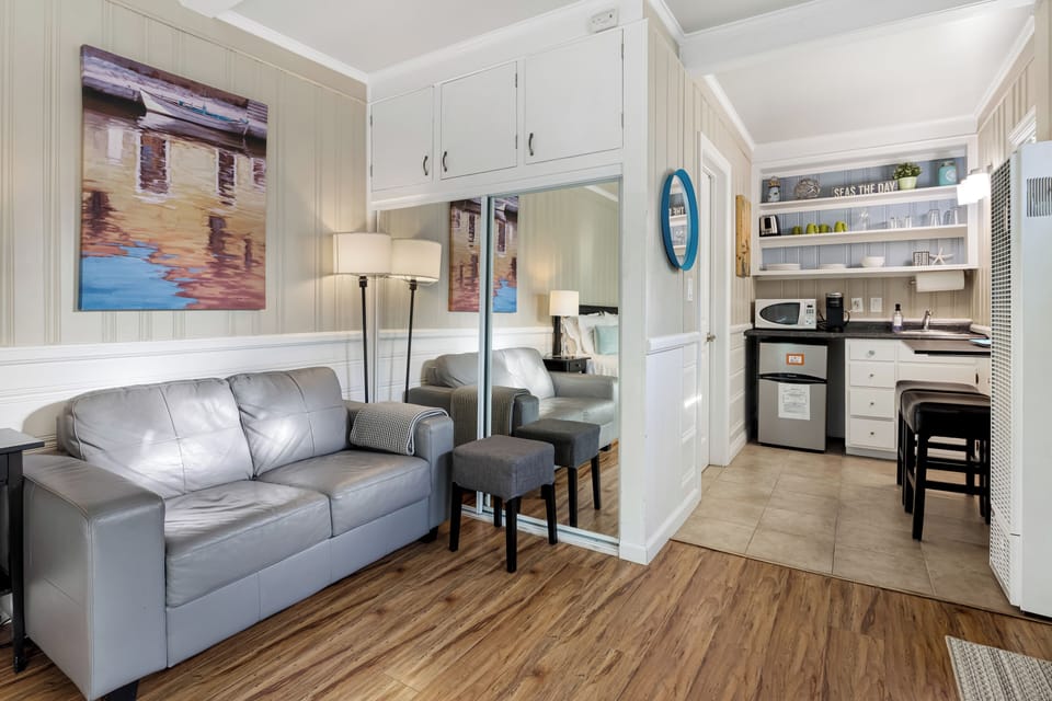 Comfortable seating area flows seamlessly from the sleeping space — perfect for relaxing or reading.