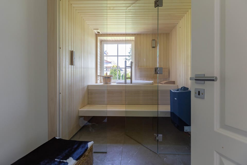 Modern Sauna with Window and Wooden Paneling