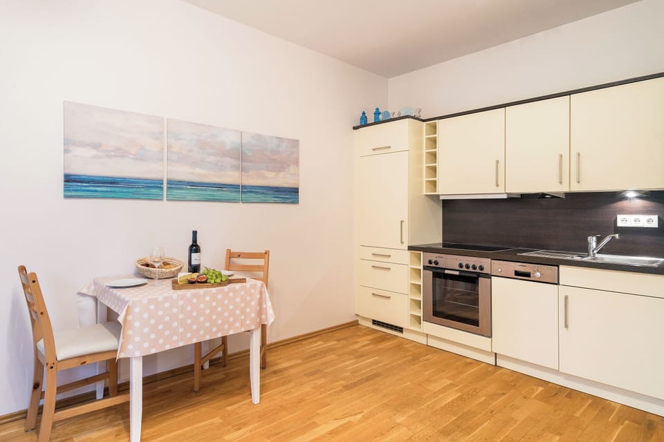 Modern kitchen with table and chairs.